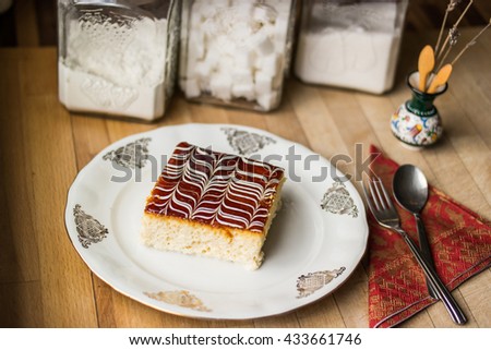 Traditional trilece dessert cake made with three milk on a wooden surface at kitchen with concept backround