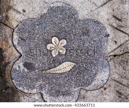 Grey ceramic floor tiles with flower closeup texture