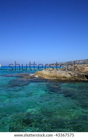 snorkeling in clear water of Mediterranean sea