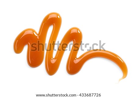 sweet caramel sauce isolated on white background, top view Royalty-Free Stock Photo #433687726