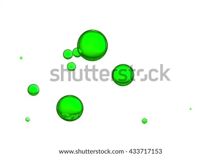 Green air bubbles isolated over a white background