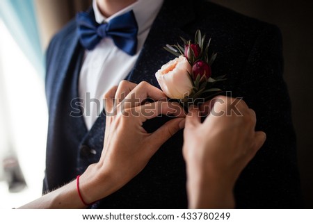 flower boutonniere in a jacket Royalty-Free Stock Photo #433780249