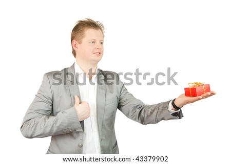  Studio shot of a businessman holding out a red present box
