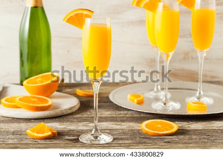 Homemade Refreshing Orange Mimosa Cocktails with Champaigne Royalty-Free Stock Photo #433800829