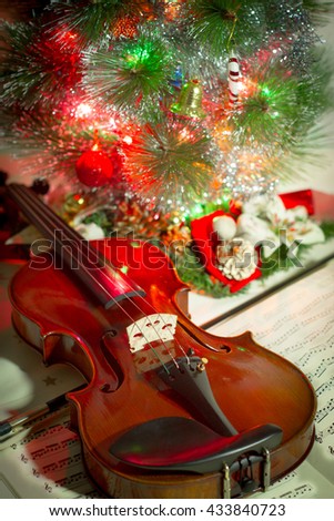 violin and sheet music with Christmas tree 2.