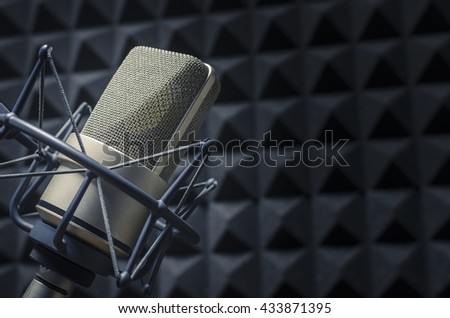 microphone in the studio with acoustic panels
