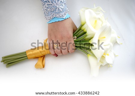 bride hand and wedding flowers. wedding ring