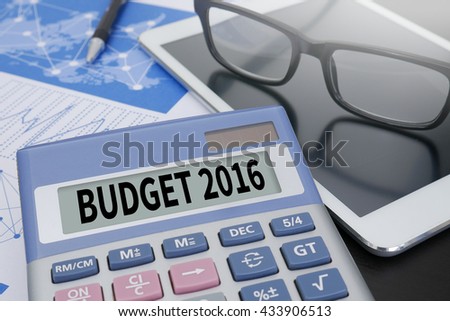 BUDGET 2016 Calculator  on table with Office Supplies. ipad