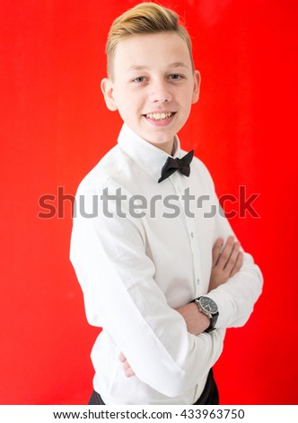 Teenage boy portrait on colorful background wall