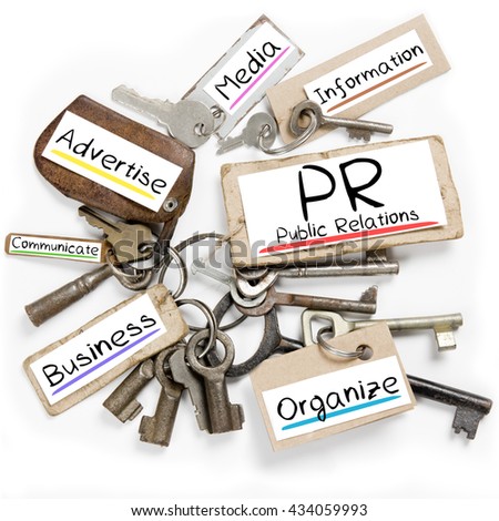 Photo of key bunch and paper tags with PR conceptual words