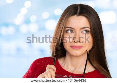 Portrait of happy smiling young business woman in glasses