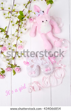 baby booties with flowers on a white background