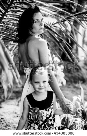 beautiful young mother daughter relaxing sitting grass background summer meadow green grass trees