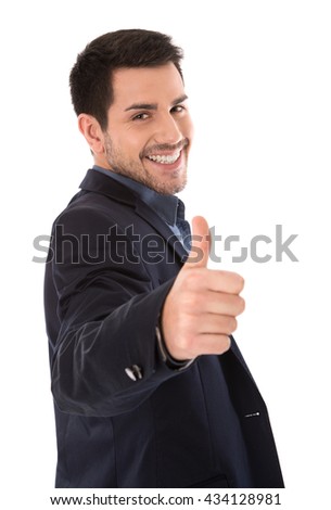 Isolated smiling businessman making thumbs up gesture.