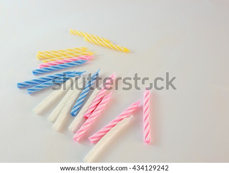 Background picture of  Variety of birthday candles in a row. Copy space.
