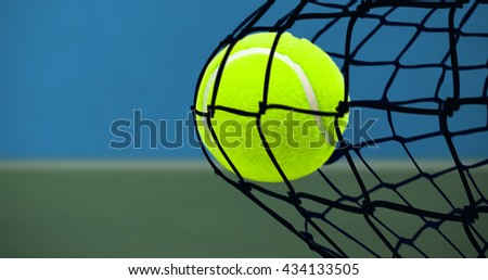 Tennis ball with a syringe against digitally generated image of bi colored background