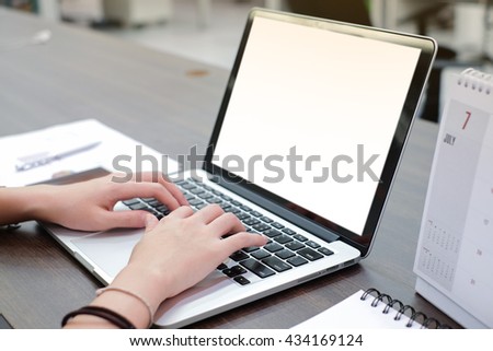 close up user employee woman hand working and typing at notebook in office room concept Royalty-Free Stock Photo #434169124
