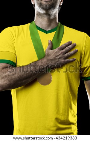 Brazilian Athlete Winning a golden medal on a black Background.