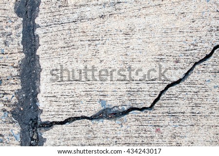 crack of concrete highway road subsidence with asphalt filler