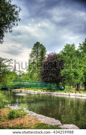 Green bridge in Victoria Park in Kitchener Waterloo Ontario Royalty-Free Stock Photo #434259988