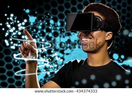 Man wearing a Virtual Reality headset and watching light paintings.  The image depicts technology and the entertainment industry.