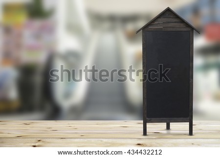 Blank restaurant blackboard on wooden floor