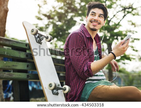 Young Skater Chilling Listening Concept