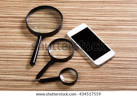 Mobile smartphone, magnifier. Top view.
