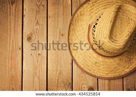 Cowboy hat on wooden vintage table. View from above