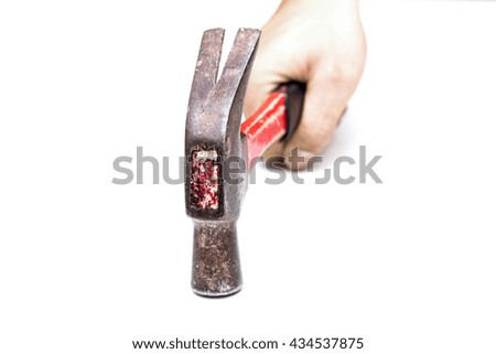 hand holding the steel hammer