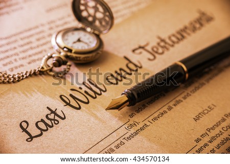 Vintage / retro style with a long shadow : Fountain pen, a pocket watch on a last will and testament. A form is printed on a mulberry paper and waiting to be filled and signed by testator / testatrix. Royalty-Free Stock Photo #434570134