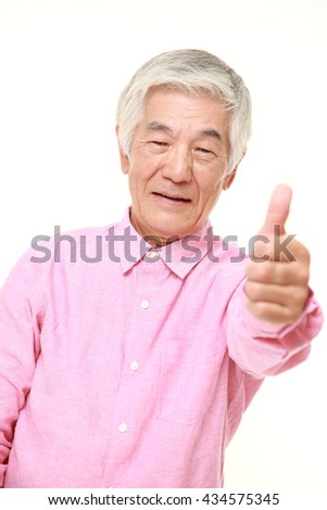 senior Japanese man in a pink shirts with thumbs up gesture