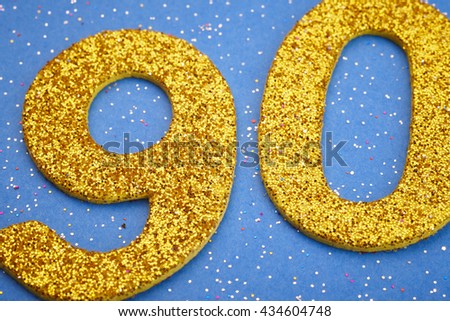 Number ninety yellow color over a blue background. Anniversary. Horizontal