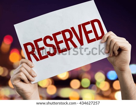 Reserved placard with night lights on background