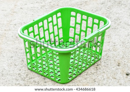 green basket on floor