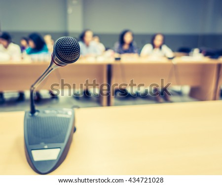 Black microphone in conference room ( Filtered image processed vintage effect. )