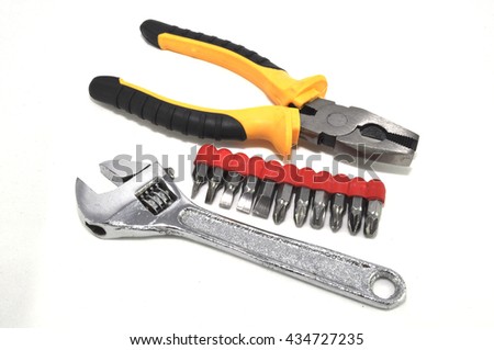 Pasatizhi flat-nose pliers a bat screw-driver on a white background close up a wrench Royalty-Free Stock Photo #434727235