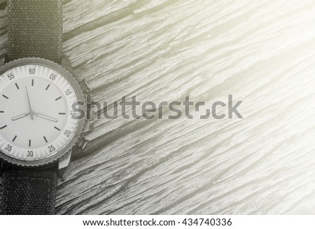 vintage Watch on the wooden background in vintage tone style / selective focus,copy space
