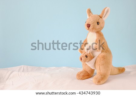 Kangaroo toys with blue background.