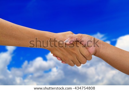 handshake in a business  shaking hand on beautiful cloud and blue sky background