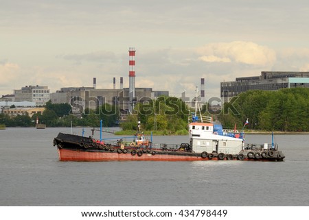 Russia.Saint-Petersburg.Port on Kanonersky island.The picture shows a tug working in the port.