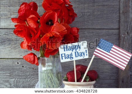 Patriotic party Concept - Happy Flag day. Heart shaped cookies color red, blue, white. Cup of coffee (tea), USA flag, decoration on old wooden table. toned filter image. Happy Flag Day CARD