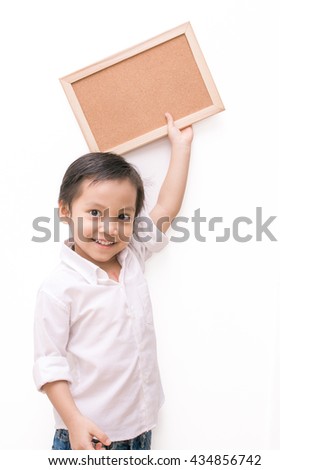 portrait of a little boy holding a board over white background