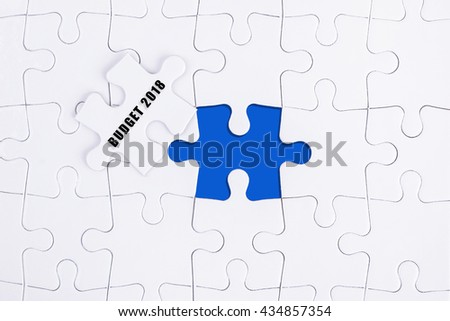 BUDGET 2018 WORD, WHITE AND BLUE MISSING PUZZLE WITH COPY SPACE AREA