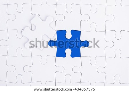 WHITE AND BLUE MISSING PUZZLE WITH COPY SPACE AREA