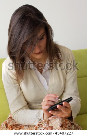 beatiful girl writing on toch screen phone