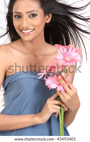  attractive teenage girl with pink daisy flowers