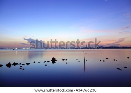 Water reflective colorful sky  before sunrise at lake on long exposure and slow shutter speed to make the water softer,select focus with shallow depth of field:ideal use for background.