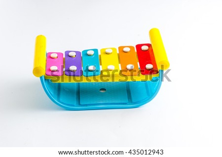Rainbow colored  toy xylophone isolated on white background