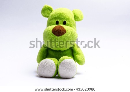 green dog bear stuffed doll on white background